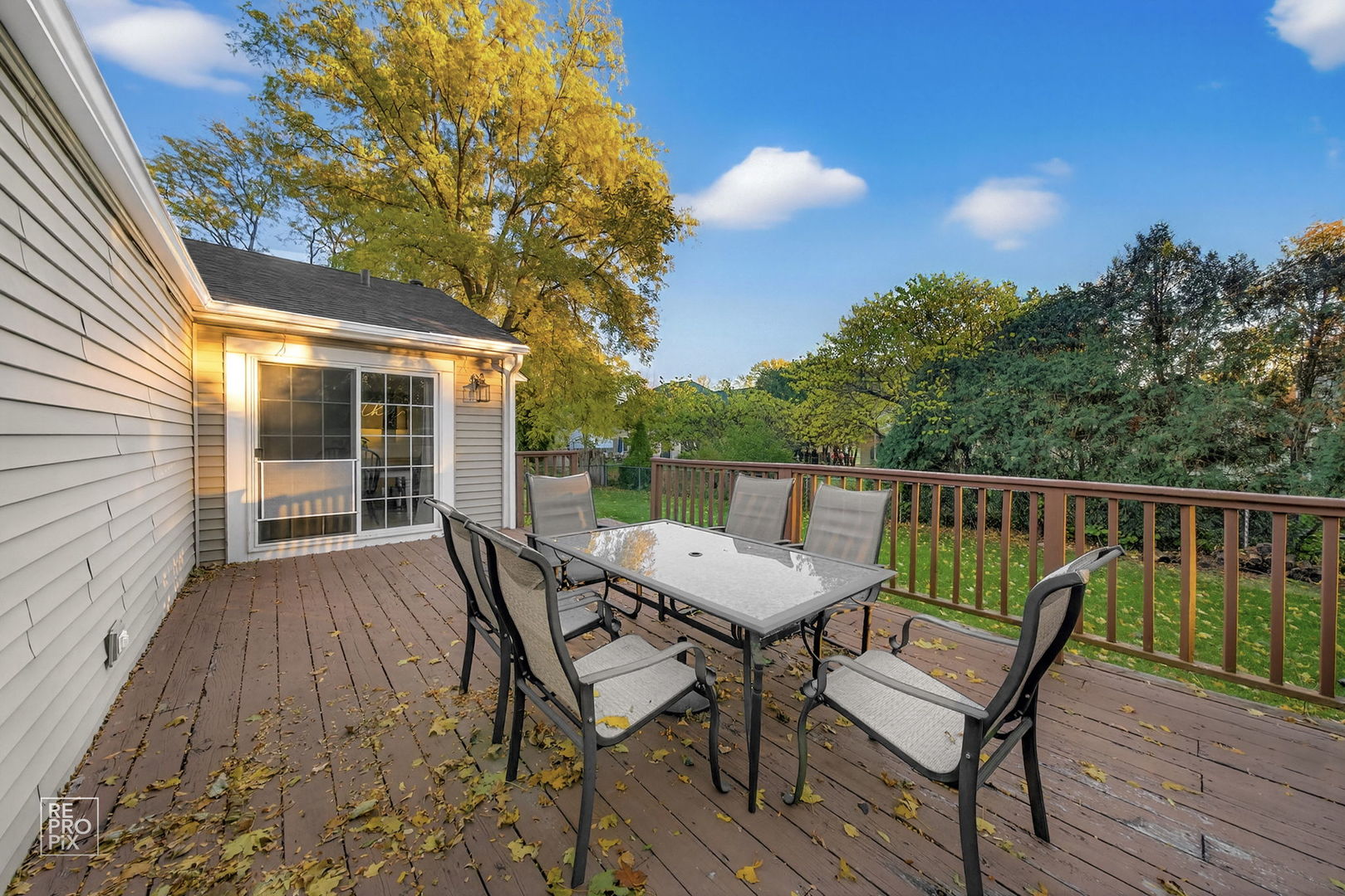 828 Carlisle Road Batavia, IL 60510 - Photo 14 of 14 a view of a wooden chairs and table on the deck