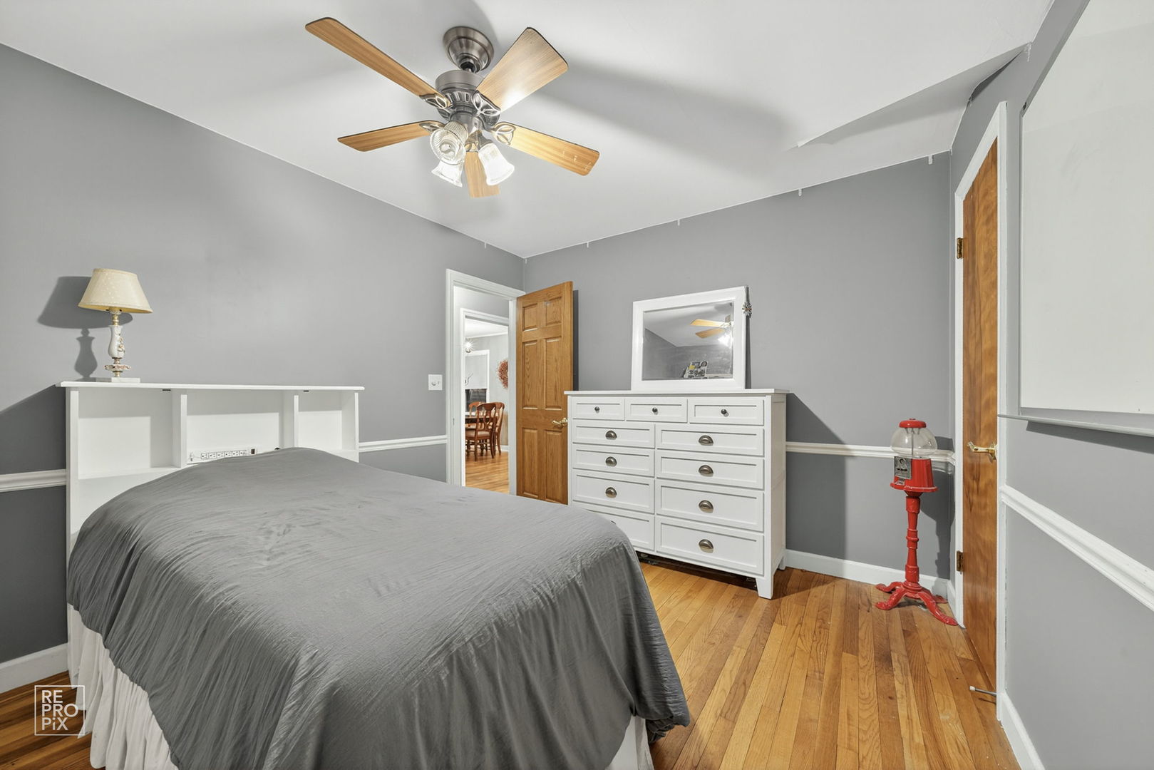 828 Carlisle Road Batavia, IL 60510 - Photo 10 of 14 a bedroom with a bed and a chandelier