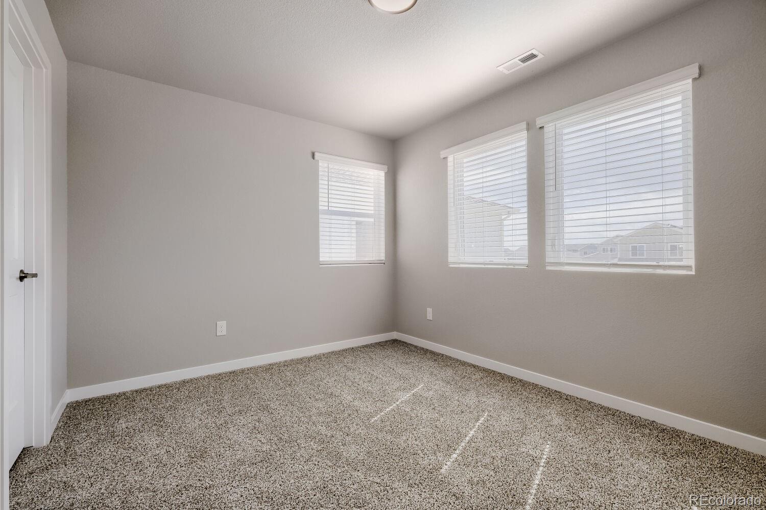 471 Atchison Way Calhan, CO 80808 - Photo 25 of 31 an empty room with windows