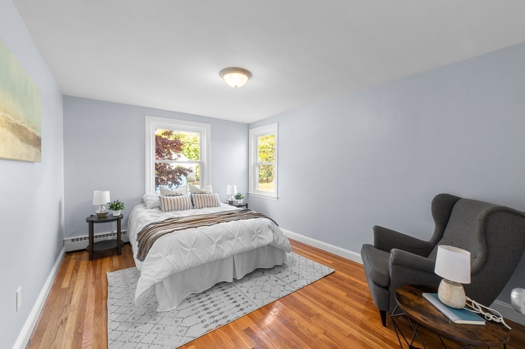 22 Leonard Road Sharon, MA 02067 - Photo 14 of 41 a bedroom with a bed chair and wooden floor