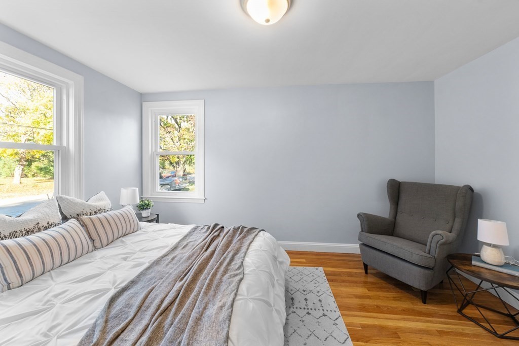 22 Leonard Road Sharon, MA 02067 - Photo 16 of 41 a bedroom with a bed and a couch with window