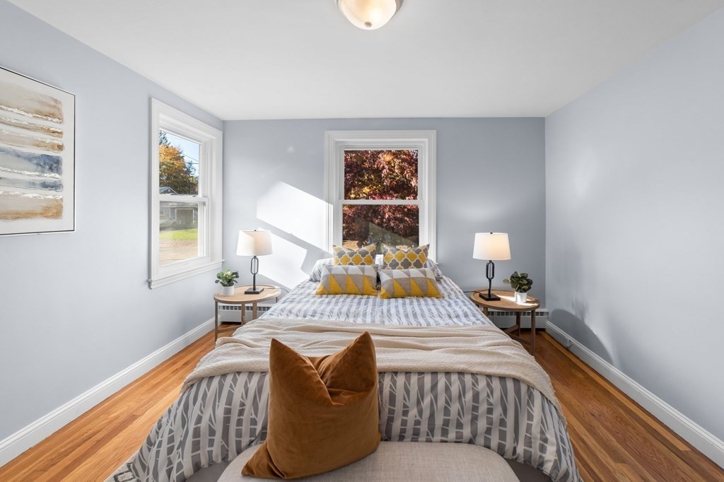 22 Leonard Road Sharon, MA 02067 - Photo 18 of 41 a bedroom with a bed and wooden floor