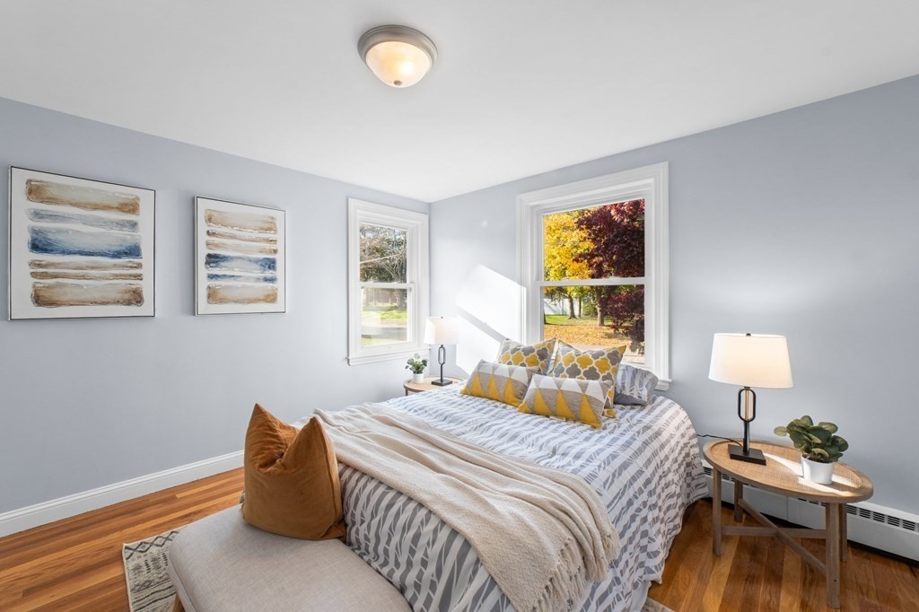22 Leonard Road Sharon, MA 02067 - Photo 19 of 41 a bedroom with a bed and wooden floor