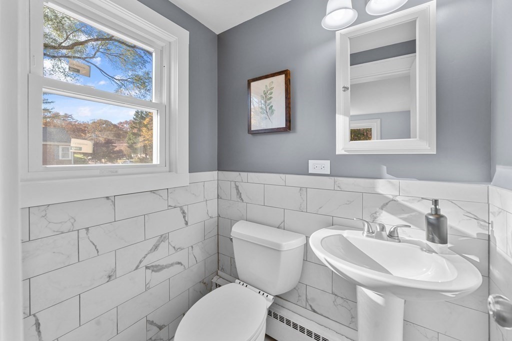 22 Leonard Road Sharon, MA 02067 - Photo 24 of 41 a bathroom with a toilet a sink and a window