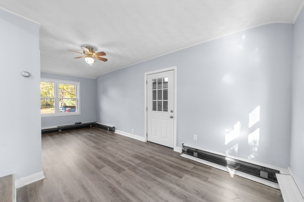 22 Leonard Road Sharon, MA 02067 - Photo 26 of 41 wooden floor in an empty room with a window