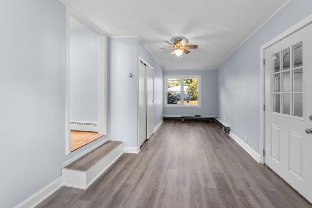 22 Leonard Road Sharon, MA 02067 - Photo 27 of 41 a view of an empty room with wooden floor and a window