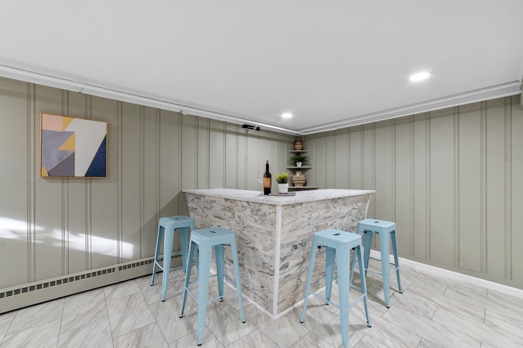 22 Leonard Road Sharon, MA 02067 - Photo 33 of 41 a dining hall with a dining table and chairs with wooden floor