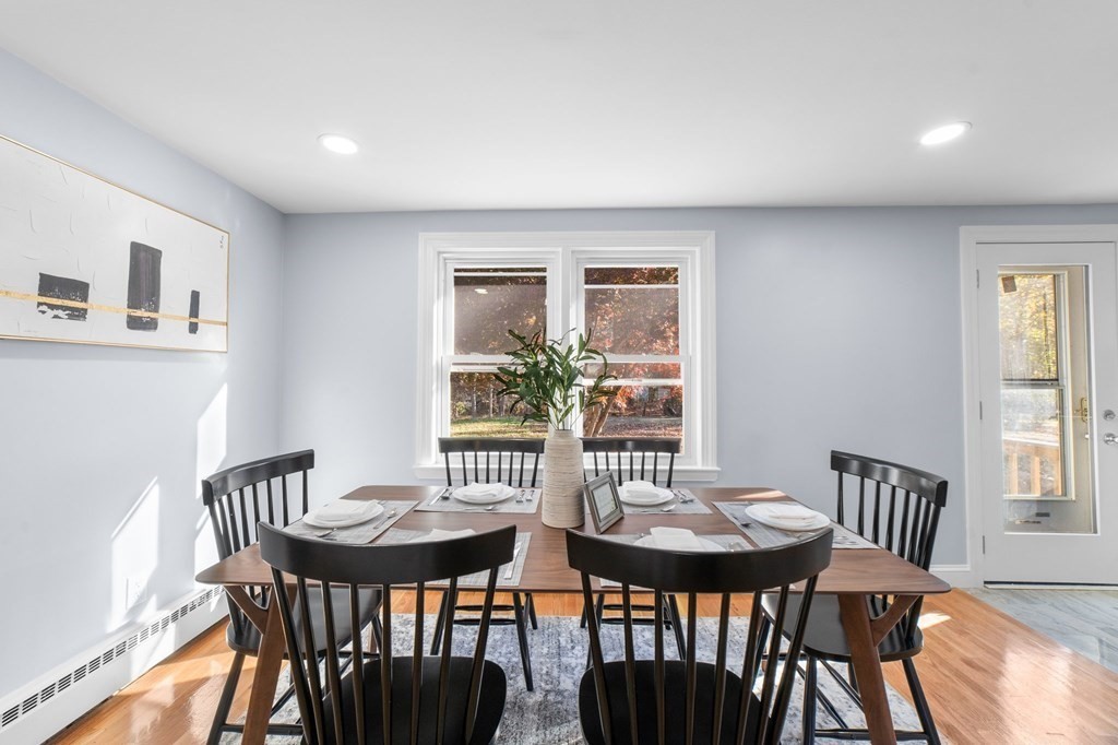 22 Leonard Road Sharon, MA 02067 - Photo 7 of 41 a view of a dining room with furniture and wooden floor