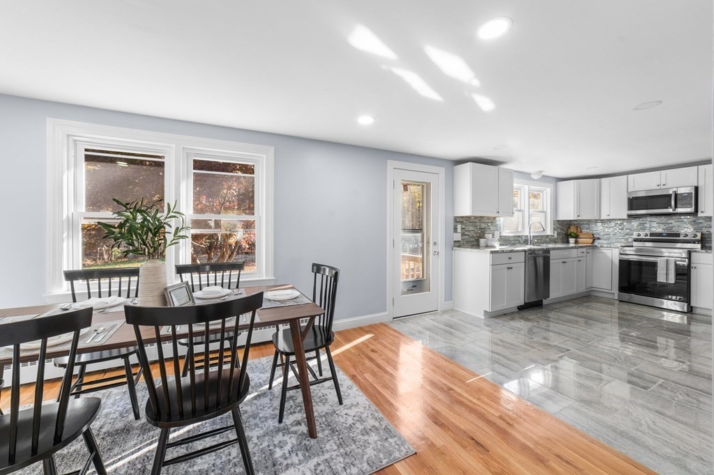 22 Leonard Road Sharon, MA 02067 - Photo 8 of 41 a view of a dining room with furniture and a kitchen