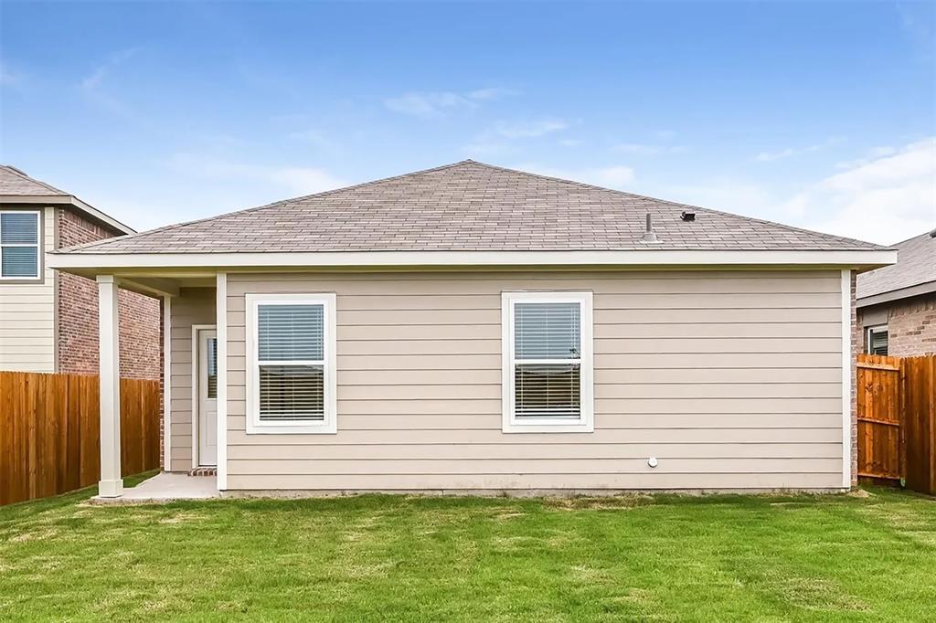 6214 Old Bridge Way Forney, TX 75126 - Photo 11 of 15 a front view of a house with a garden