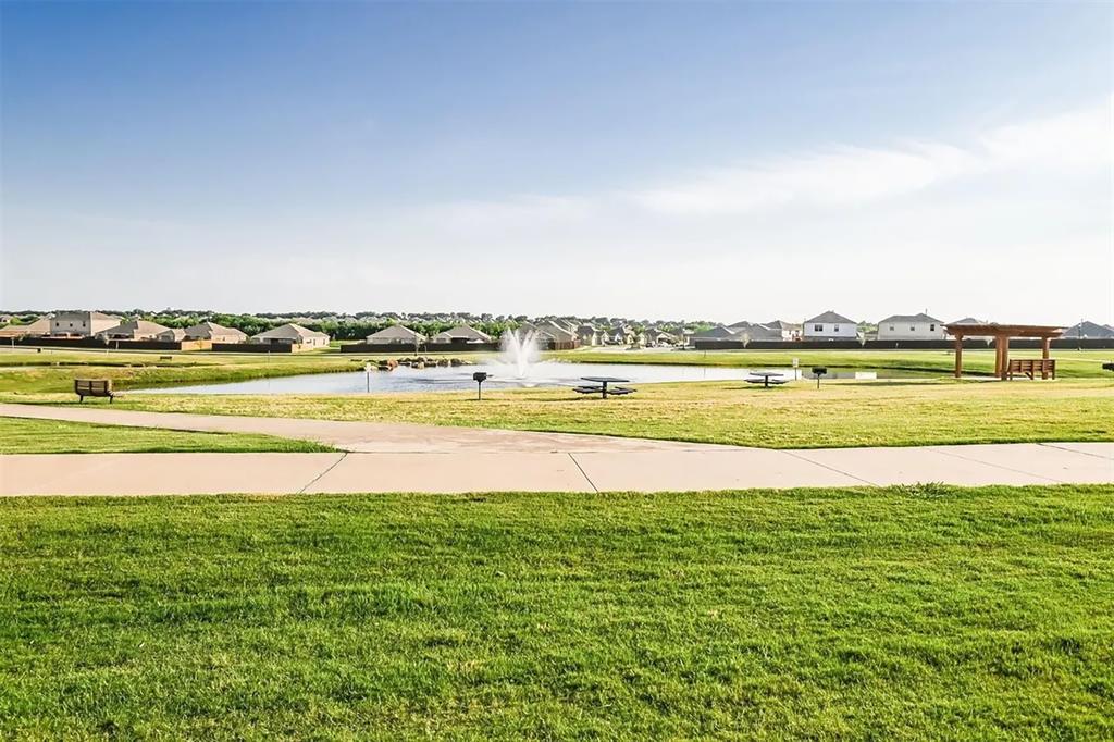 6214 Old Bridge Way Forney, TX 75126 - Photo 12 of 15 a view of an ocean and beach