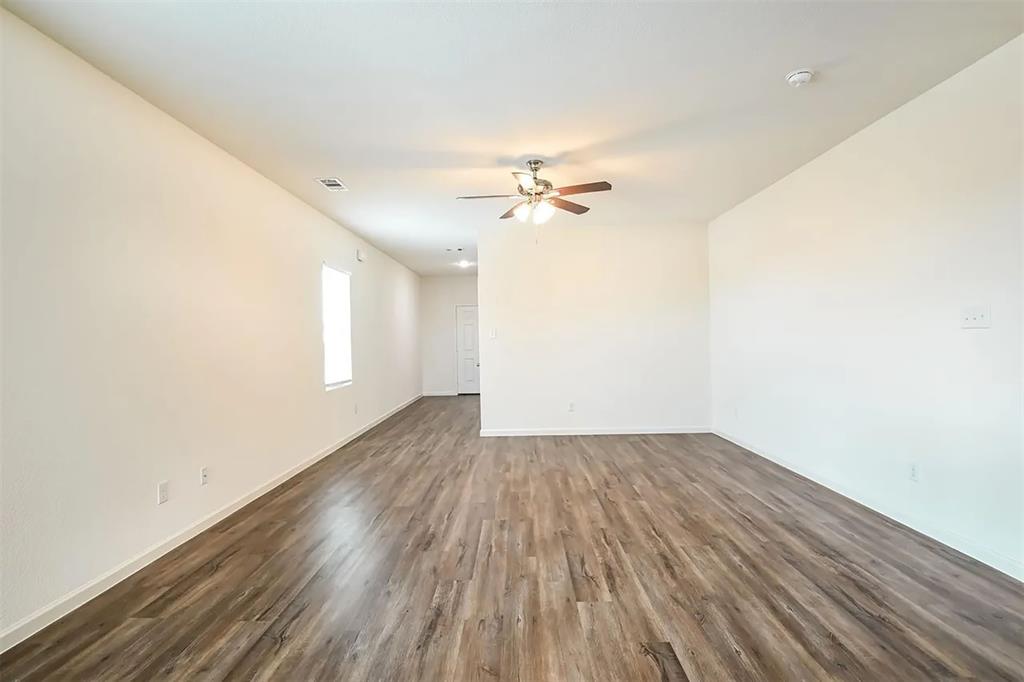 6214 Old Bridge Way Forney, TX 75126 - Photo 7 of 15 wooden floor in an empty room