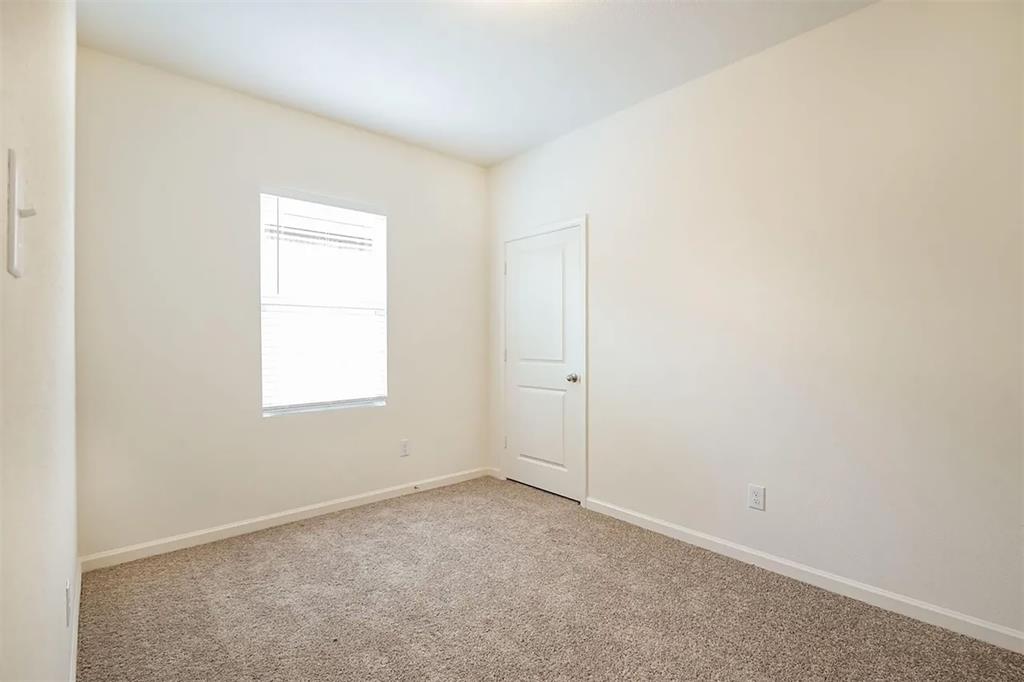 6214 Old Bridge Way Forney, TX 75126 - Photo 9 of 15 an empty room with a window