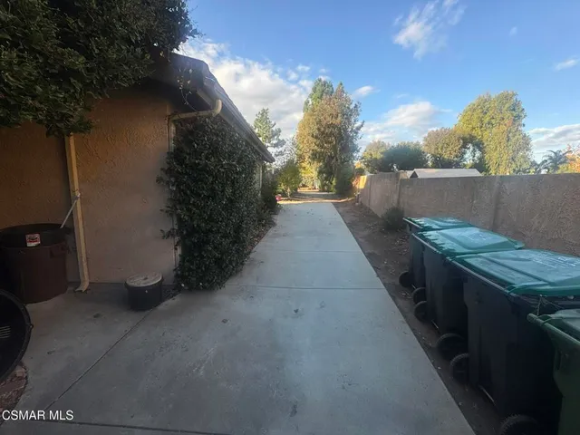 a view of a house with swimming pool and sitting area