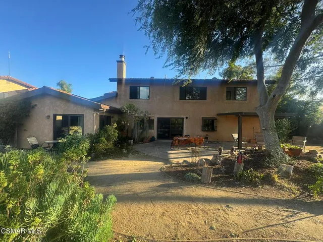 a view of a chairs and tables in the patio