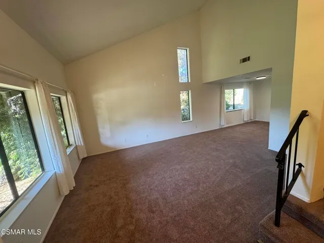 a view of a hallway with windows