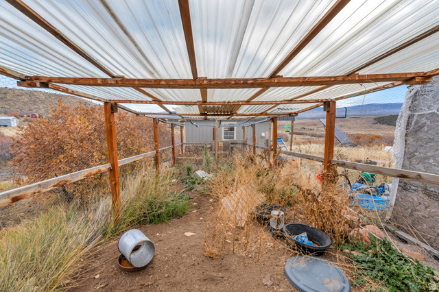 137 East Canyon Hollow Road, Unit 137 Fairview, UT 84629 - Photo 21 of 25 View of yard with a mountain view and an outbuilding