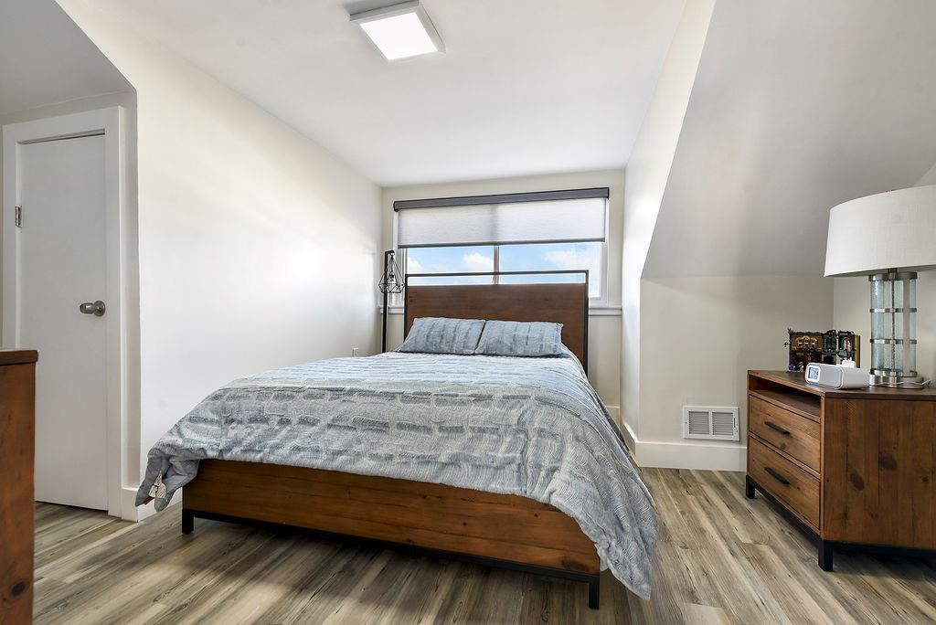 6906 Standish Street Pittsburgh, PA 15206 - Photo 24 of 31 a bedroom with a bed and a window
