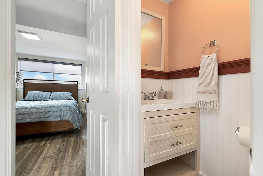 6906 Standish Street Pittsburgh, PA 15206 - Photo 25 of 31 a bedroom with a bed and a mirror