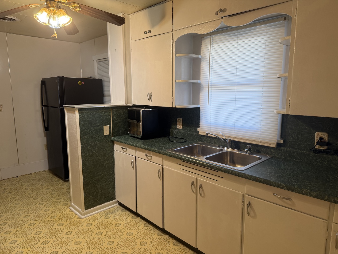205 Kimmel Bridge Road Murphysboro, IL 62966 - Photo 12 of 33 a kitchen with stainless steel appliances granite countertop a refrigerator and a sink