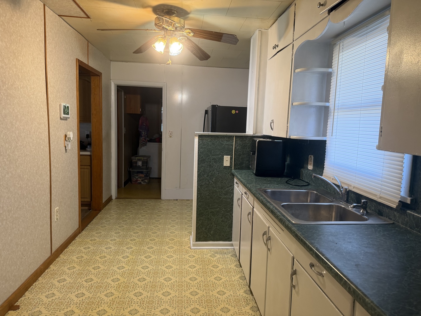 205 Kimmel Bridge Road Murphysboro, IL 62966 - Photo 13 of 33 a kitchen with a sink and refrigerator