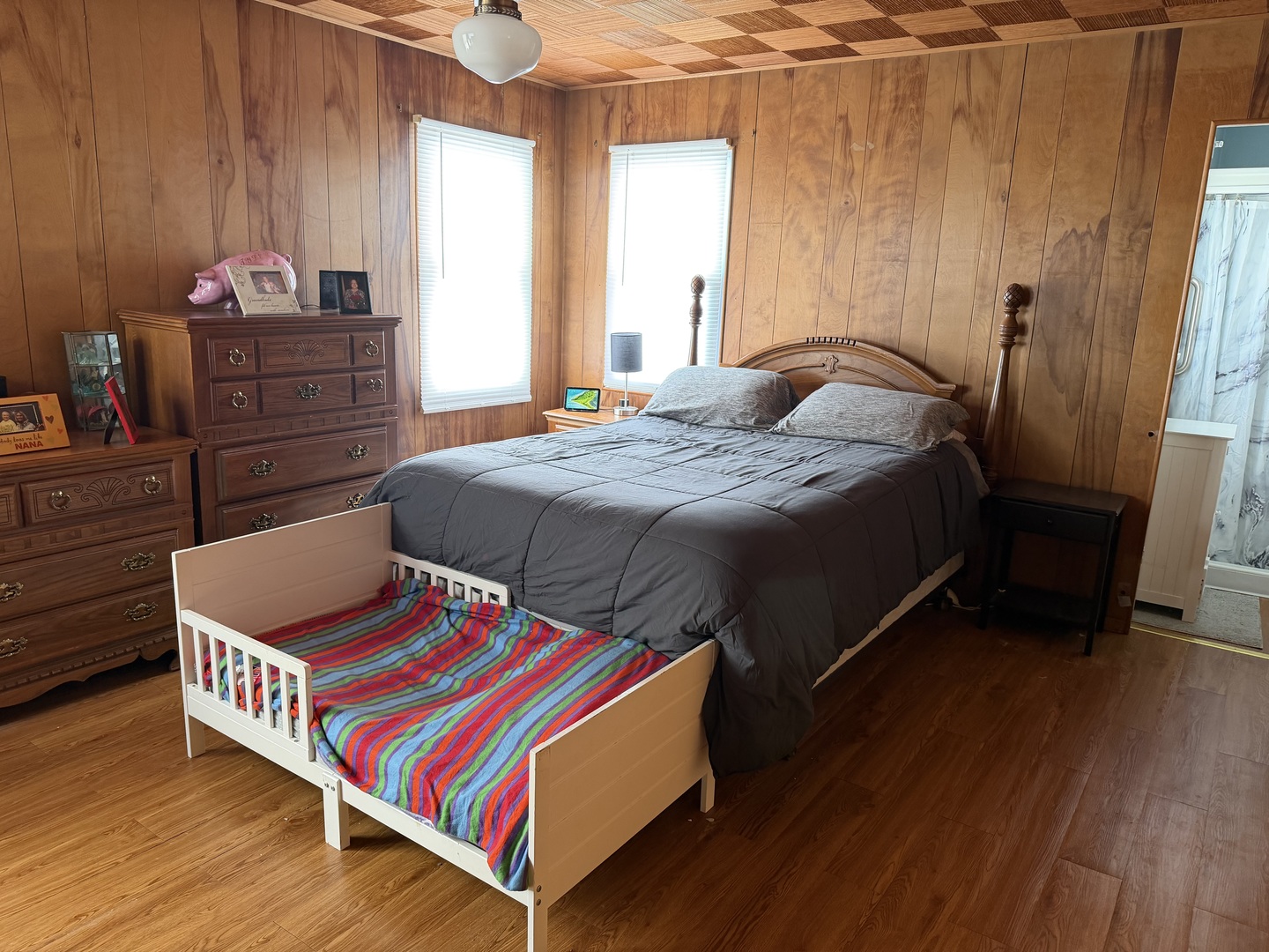 205 Kimmel Bridge Road Murphysboro, IL 62966 - Photo 18 of 33 a bedroom with a bed and wooden floor