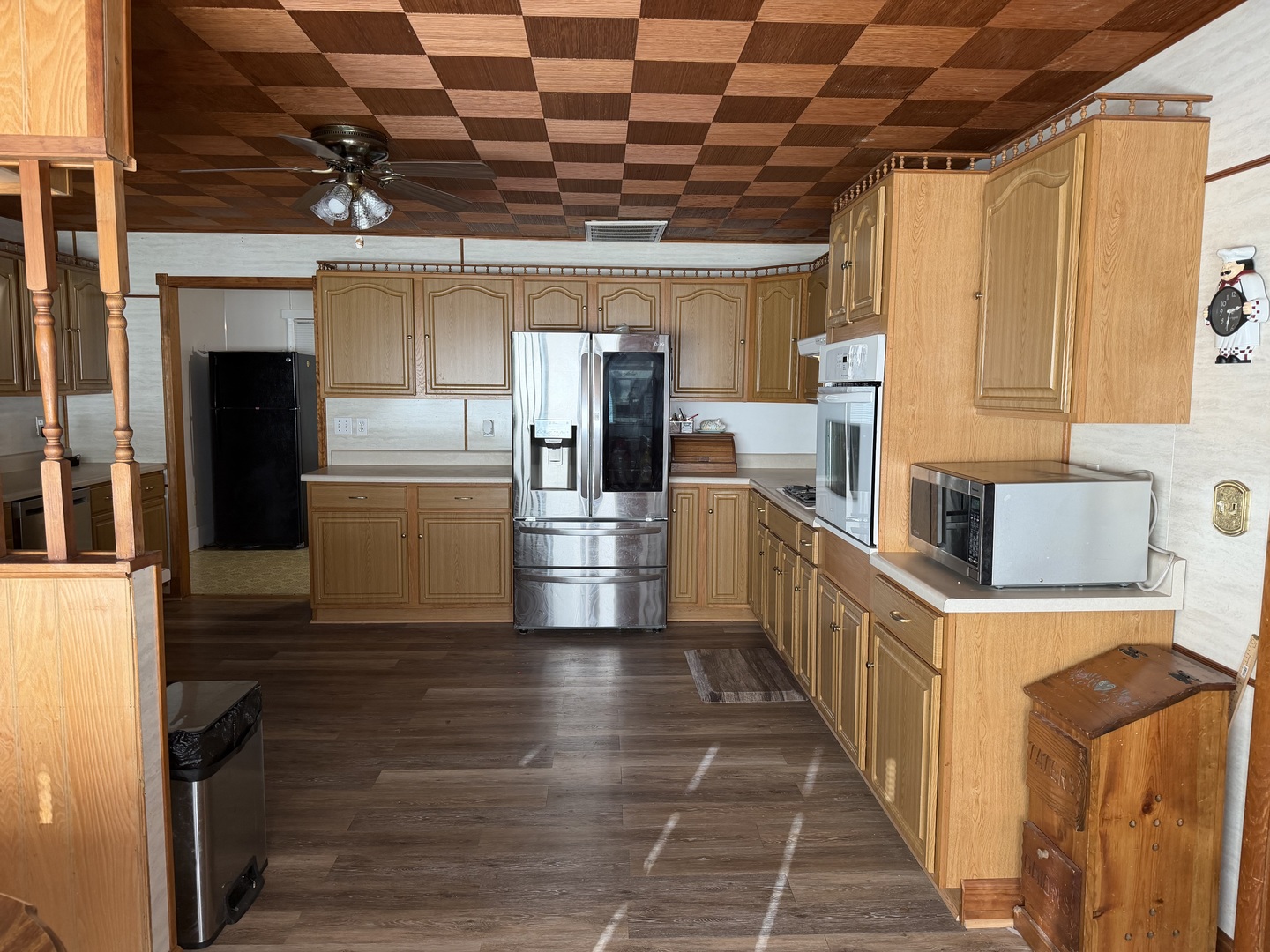 205 Kimmel Bridge Road Murphysboro, IL 62966 - Photo 5 of 33 a view of a kitchen with wooden cabinets and outdoor space