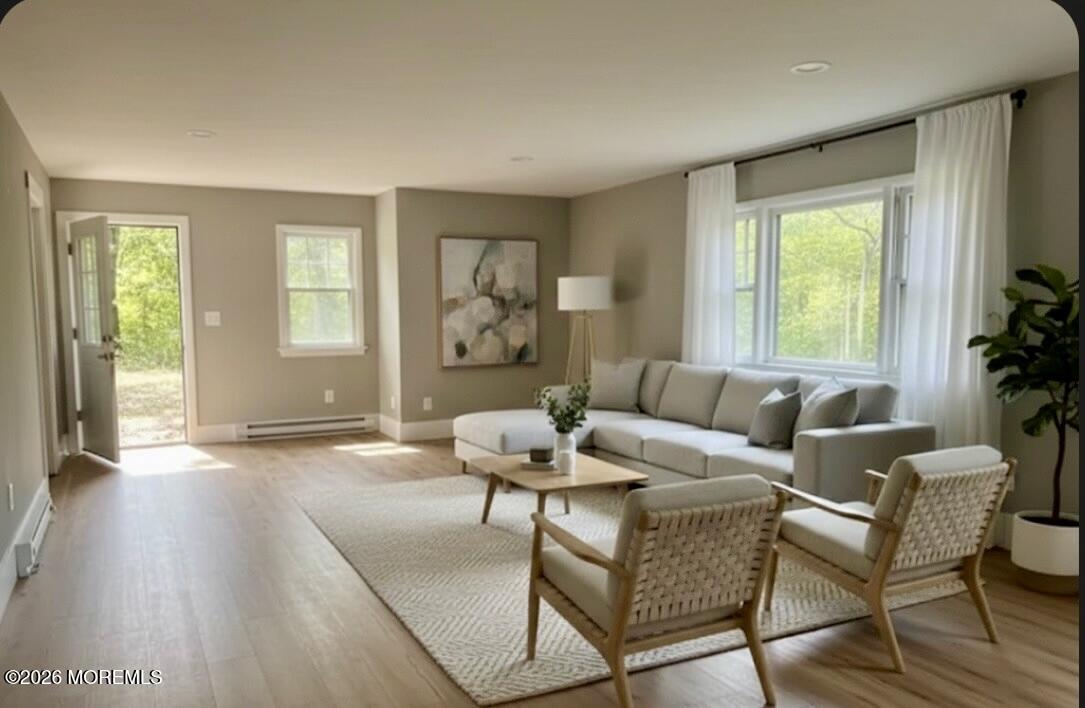 17 North Main Street Marlboro, NJ 07746 - Photo 22 of 67 a living room with furniture and a window