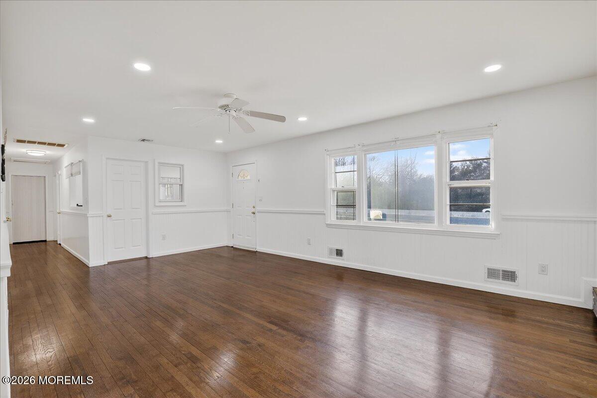 17 North Main Street Marlboro, NJ 07746 - Photo 28 of 67 a view of empty room with wooden floor and windows