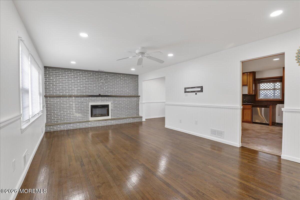 17 North Main Street Marlboro, NJ 07746 - Photo 30 of 67 an empty room with wooden floor and windows