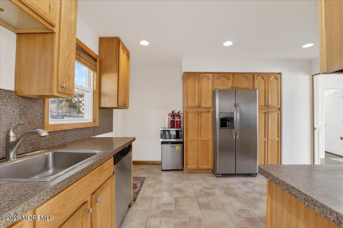 17 North Main Street Marlboro, NJ 07746 - Photo 34 of 67 a kitchen that has a sink cabinets counter space and stainless steel appliances