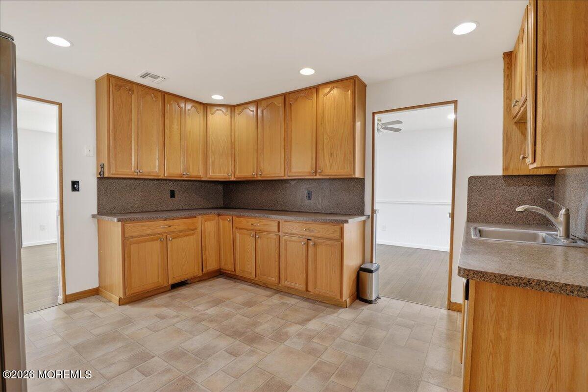 17 North Main Street Marlboro, NJ 07746 - Photo 36 of 67 a bathroom with a granite countertop sink and a mirror