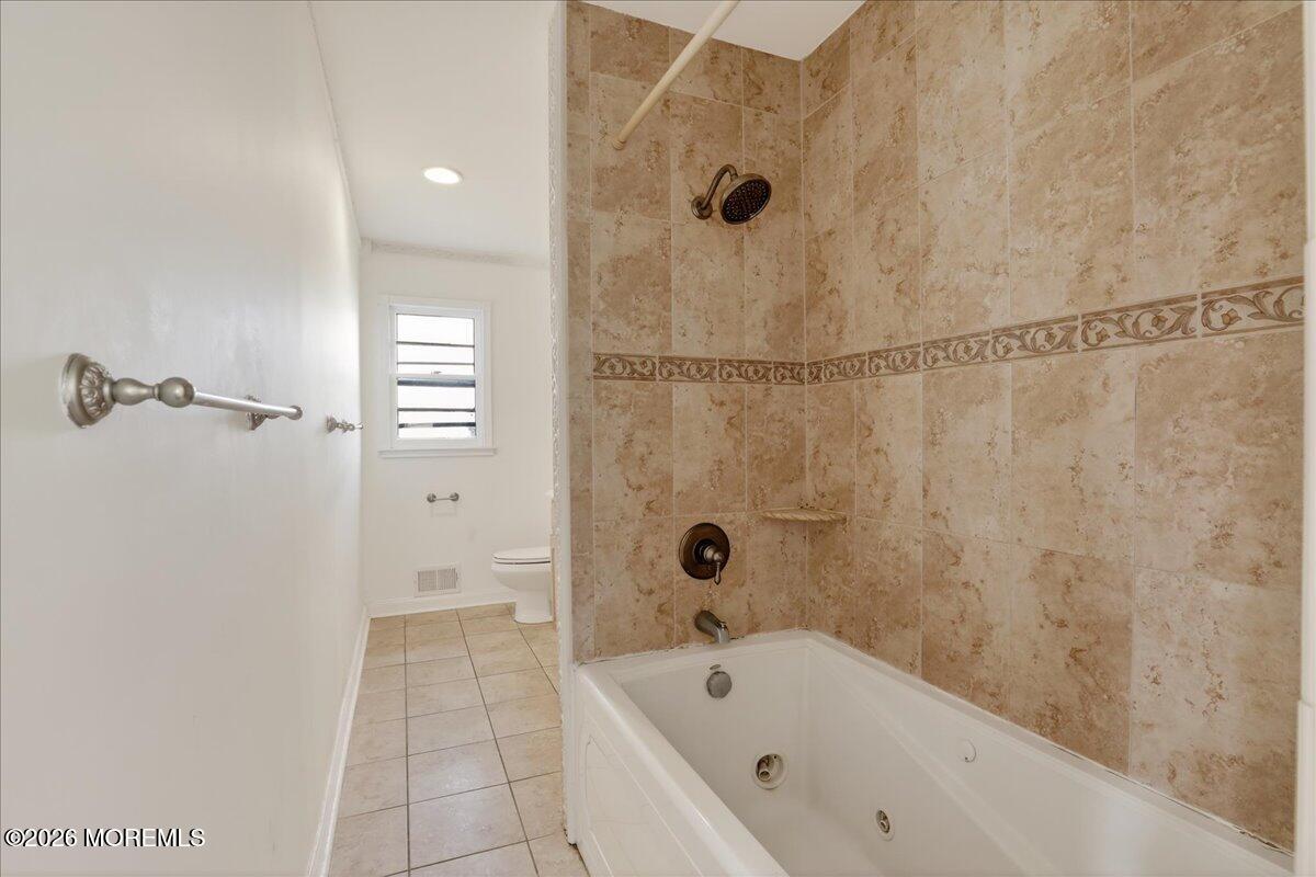 17 North Main Street Marlboro, NJ 07746 - Photo 39 of 67 a bathroom with a bathtub and a shower