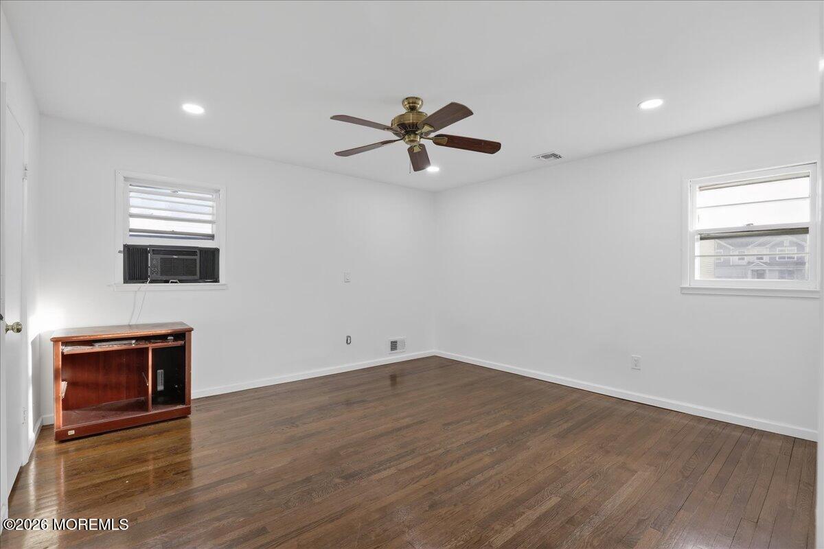 17 North Main Street Marlboro, NJ 07746 - Photo 43 of 67 wooden floor in an empty room with a window