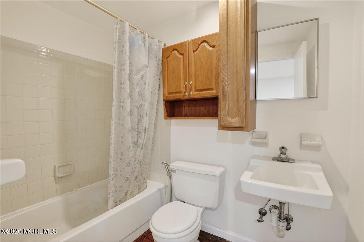 17 North Main Street Marlboro, NJ 07746 - Photo 46 of 67 a bathroom with a toilet a sink and bathtub