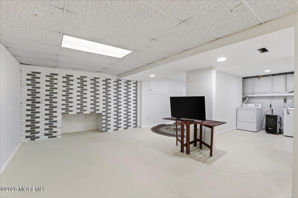 17 North Main Street Marlboro, NJ 07746 - Photo 47 of 67 a room with furniture and a flat screen tv