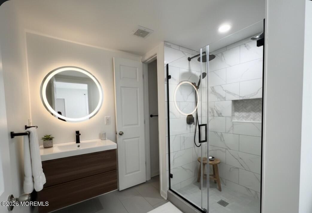 17 North Main Street Marlboro, NJ 07746 - Photo 58 of 67 a bathroom with a sink a toilet and shower