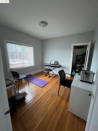 a living room with furniture a rug and a window