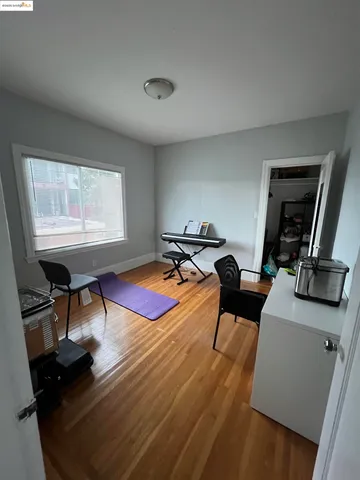 a living room with furniture a rug and a window