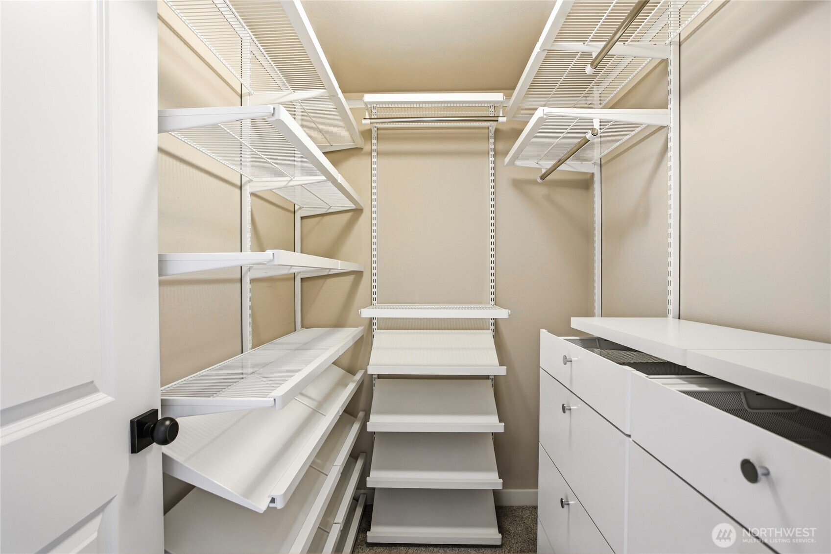 2635 Northwest 57th Street, Unit B Seattle, WA 98107 - Photo 15 of 28 a view of walk in closet with empty racks