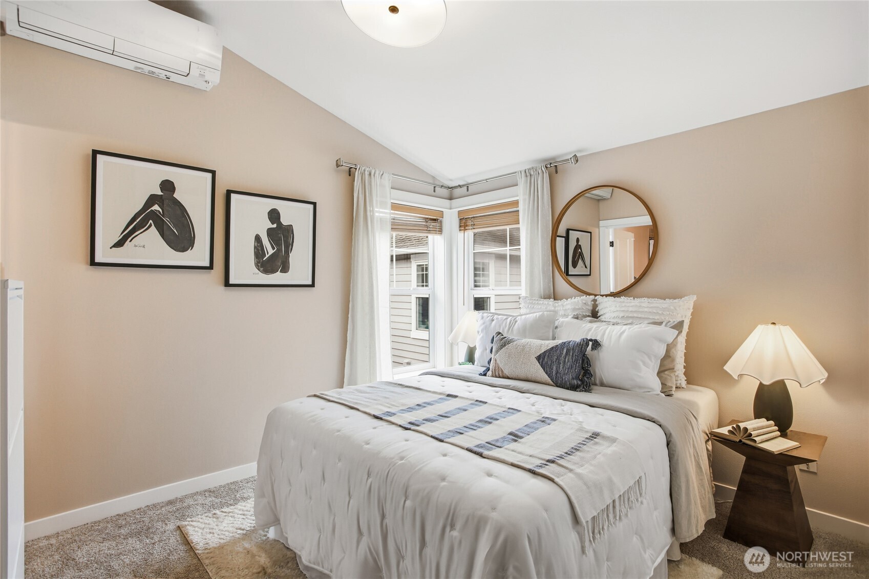 2635 Northwest 57th Street, Unit B Seattle, WA 98107 - Photo 16 of 28 a bedroom with a bed and a painting on the wall