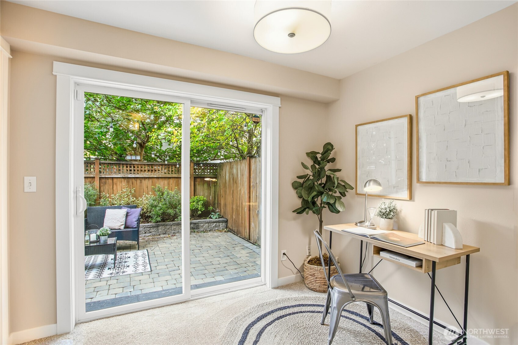 2635 Northwest 57th Street, Unit B Seattle, WA 98107 - Photo 18 of 28 a living room with furniture and a potted plant