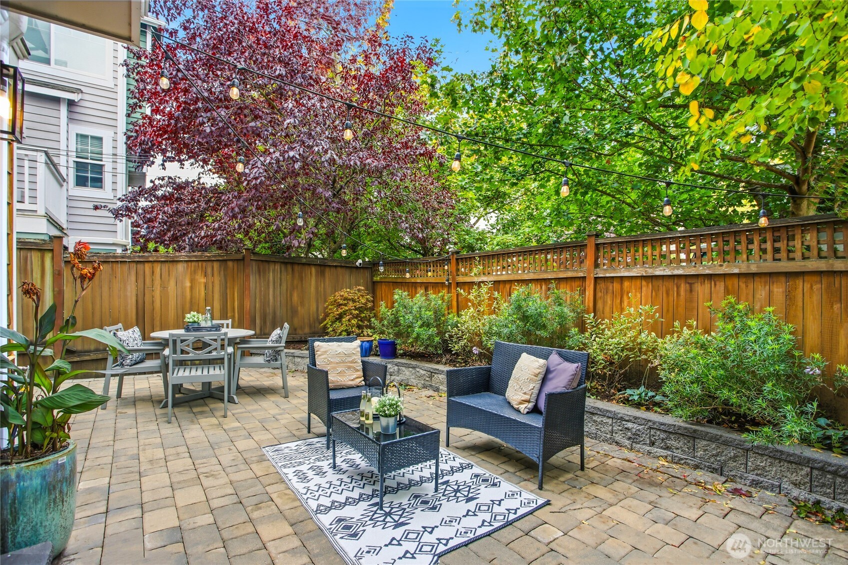 2635 Northwest 57th Street, Unit B Seattle, WA 98107 - Photo 2 of 28 a view of a patio with couches and a table
