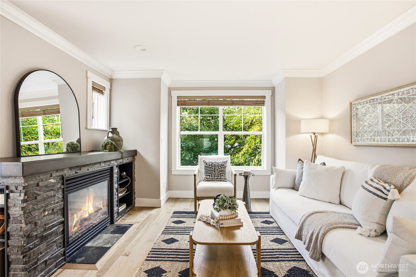 2635 Northwest 57th Street, Unit B Seattle, WA 98107 - Photo 4 of 28 a living room with furniture a fireplace and a large window