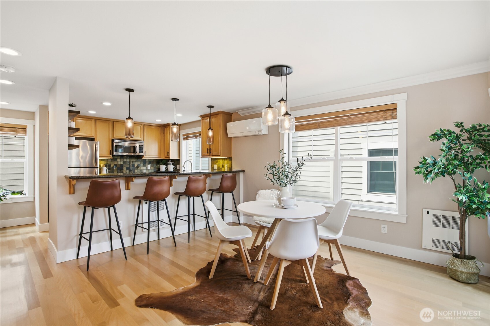 2635 Northwest 57th Street, Unit B Seattle, WA 98107 - Photo 6 of 28 a view of a dining room with furniture window and wooden floor