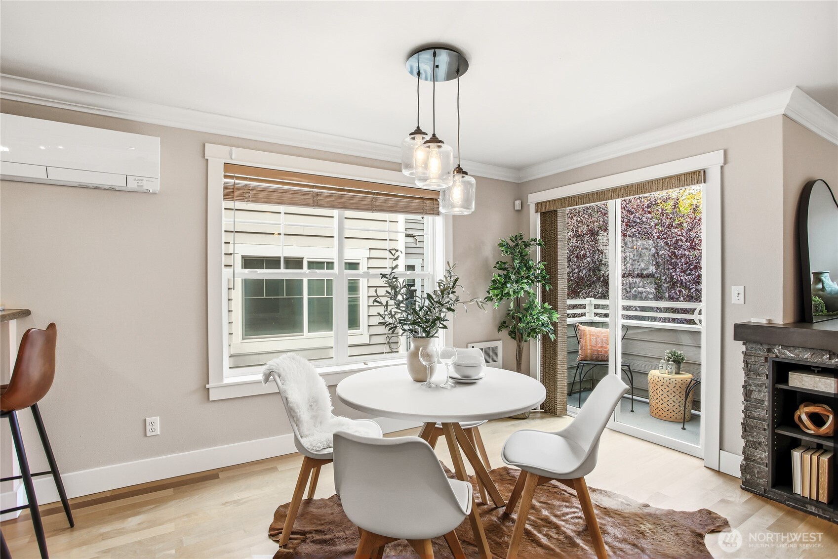 2635 Northwest 57th Street, Unit B Seattle, WA 98107 - Photo 7 of 28 a dining room with furniture a chandelier and wooden floor