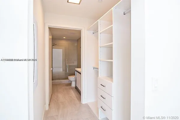 a bathroom with a toilet sink and a mirror