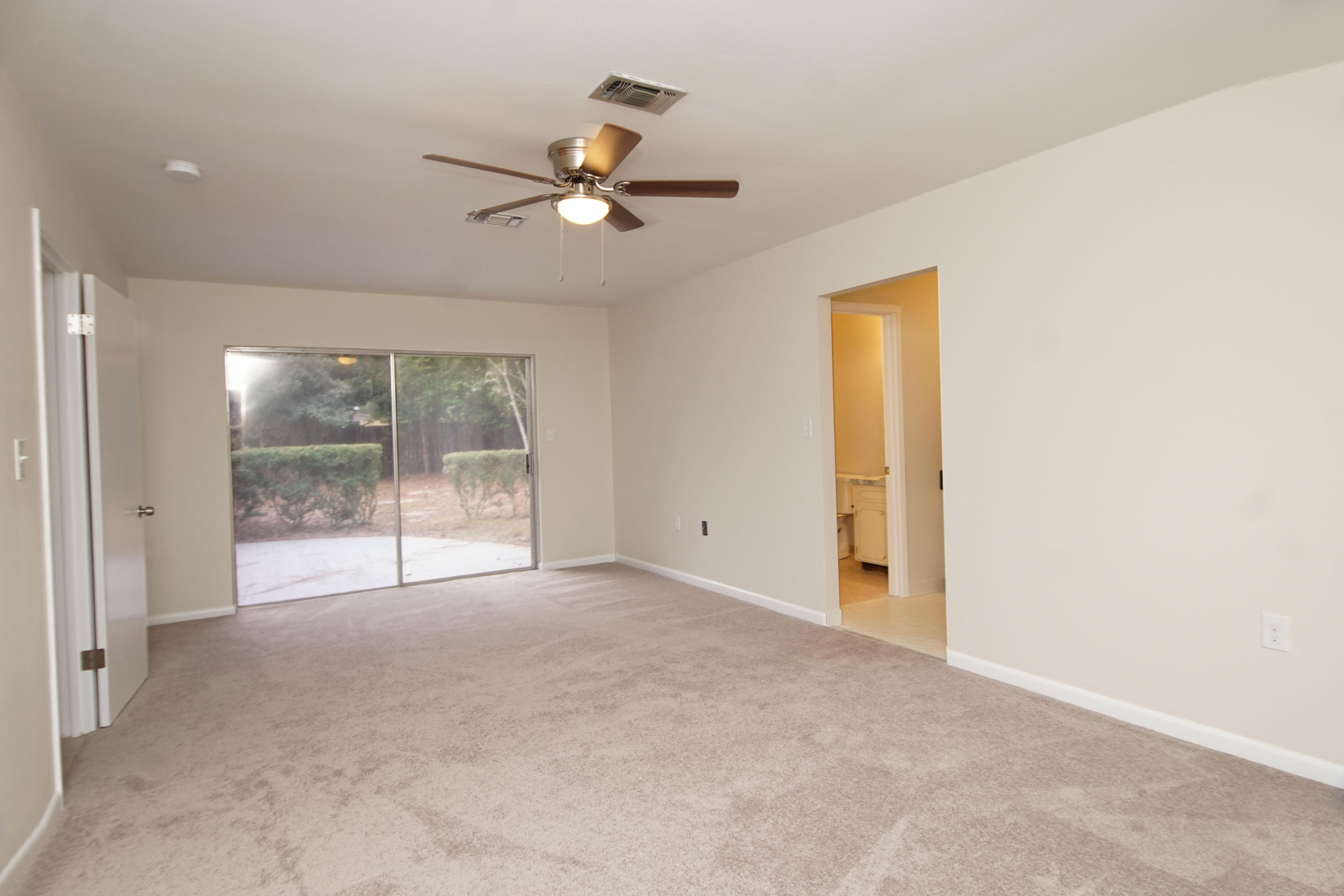115 Country Club Road Shalimar, FL 32579 - Photo 14 of 25 a view of an empty room with a window