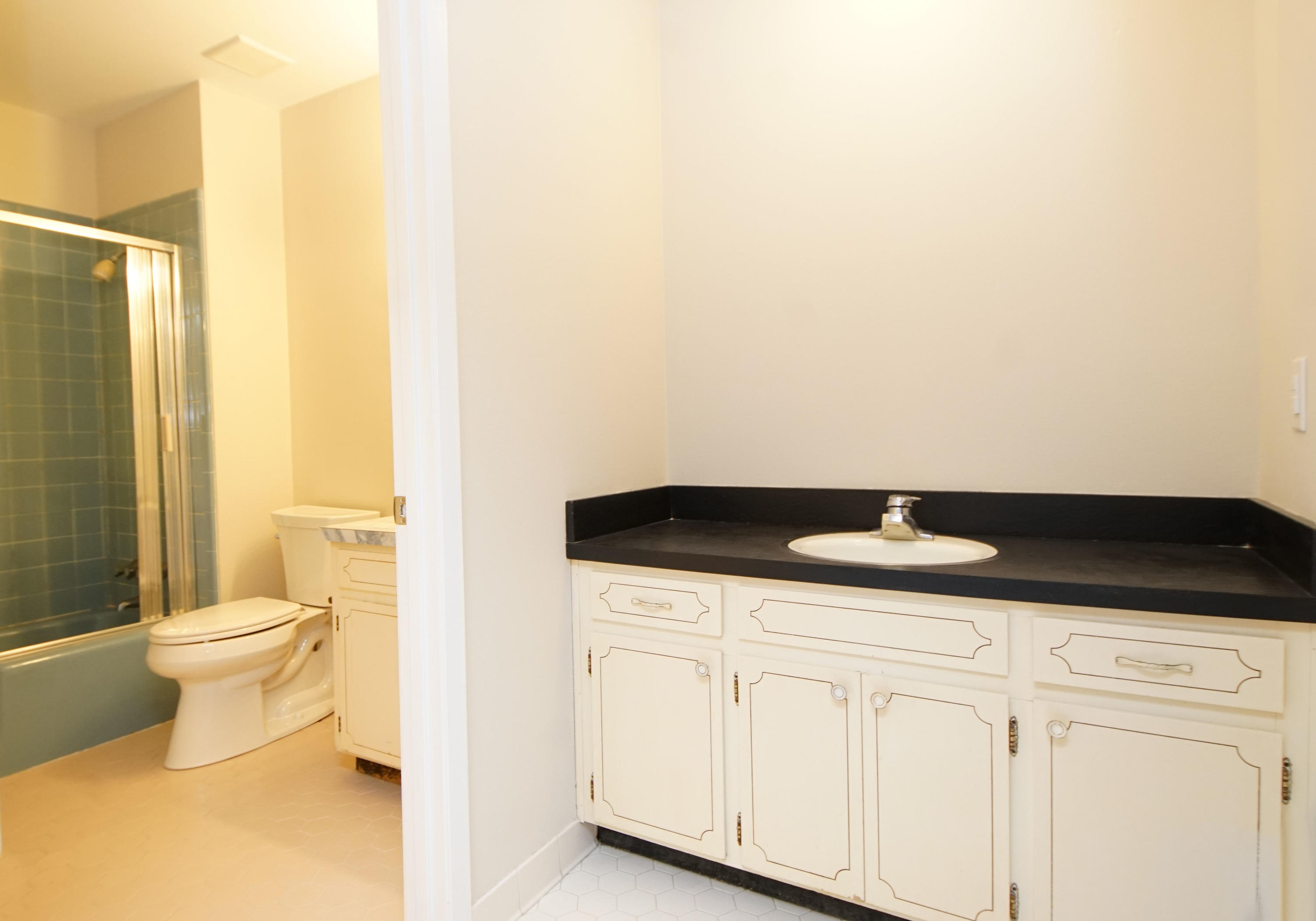 115 Country Club Road Shalimar, FL 32579 - Photo 15 of 25 a bathroom with a granite countertop sink and a toilet