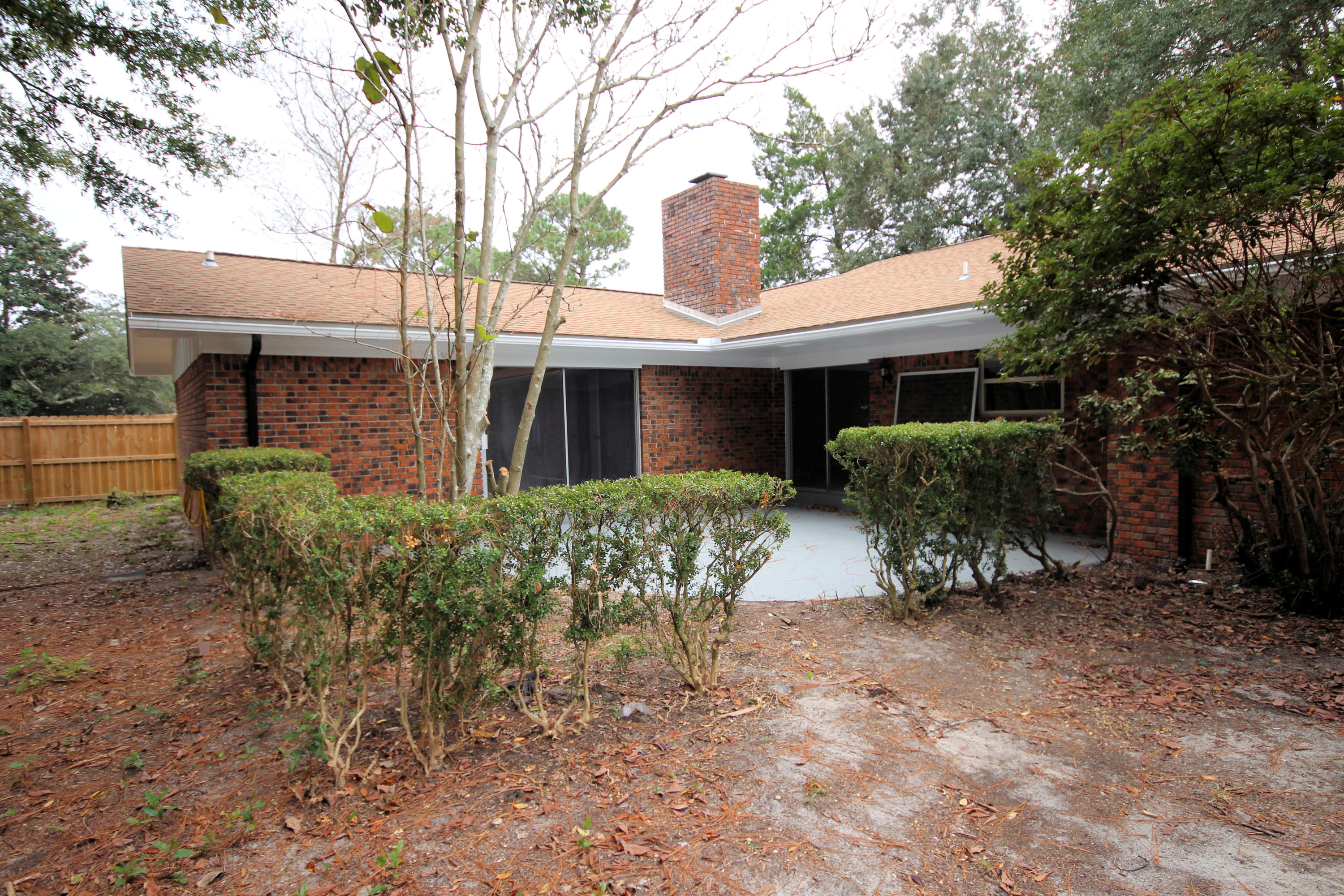 115 Country Club Road Shalimar, FL 32579 - Photo 20 of 25 a view of house with a yard and sitting area